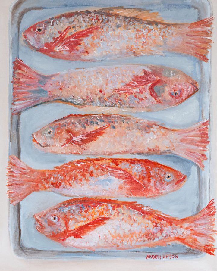 An up close of the original oil painting of 5 beautiful red fish with dimension sof color on their scales lying on a silver baking pan. The best food art for your kitchen , dining room or breakfast nook. Great for a gallery wall paired with other pieces from the Frank's Table Collection