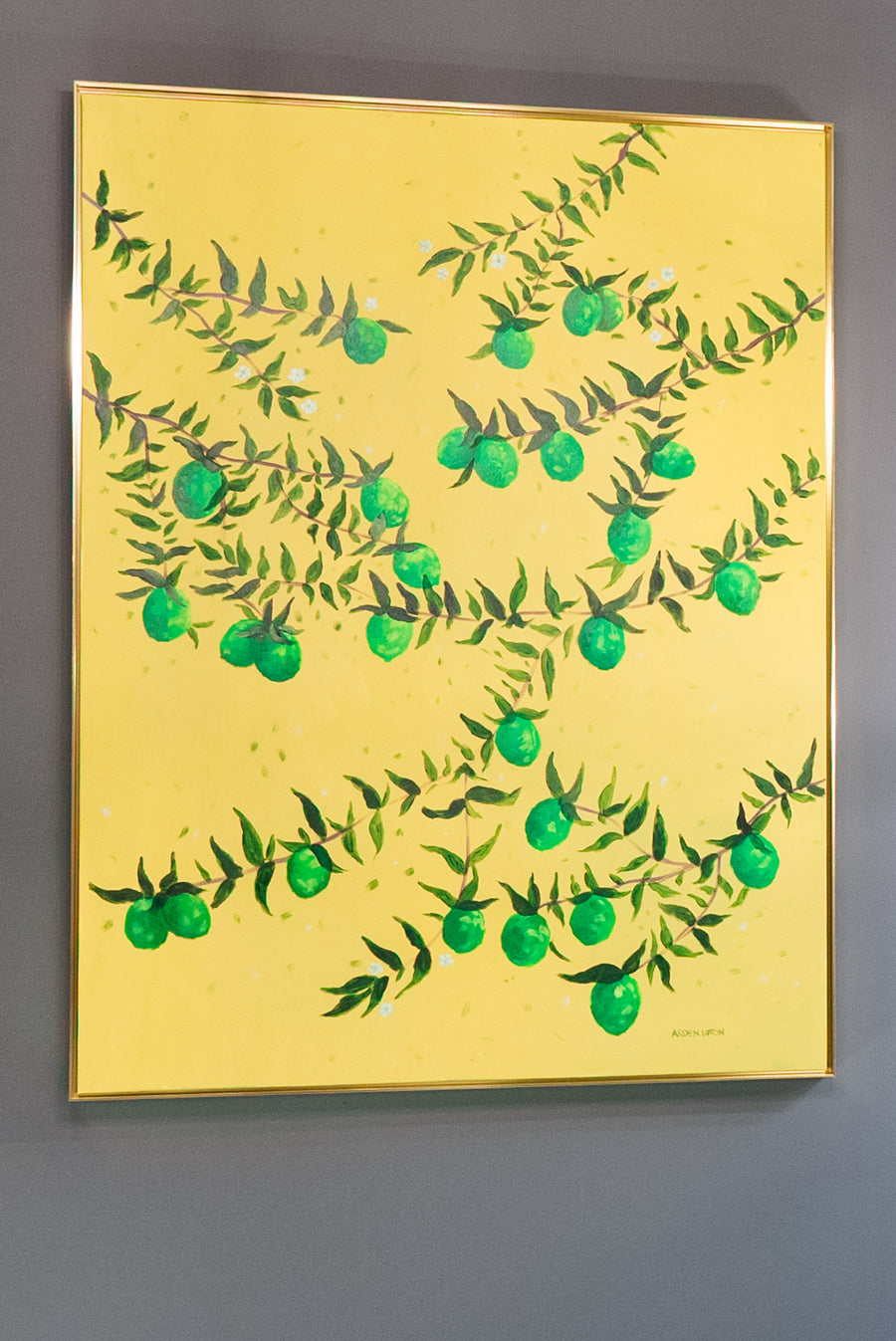Original Painting by Southern Artist Arden Upton featuring branches of a lime tree full of vibrant green limes and leaves on a bright yellow background. Perfect for decorating the walls of dining rooms, kitchens and other areas.