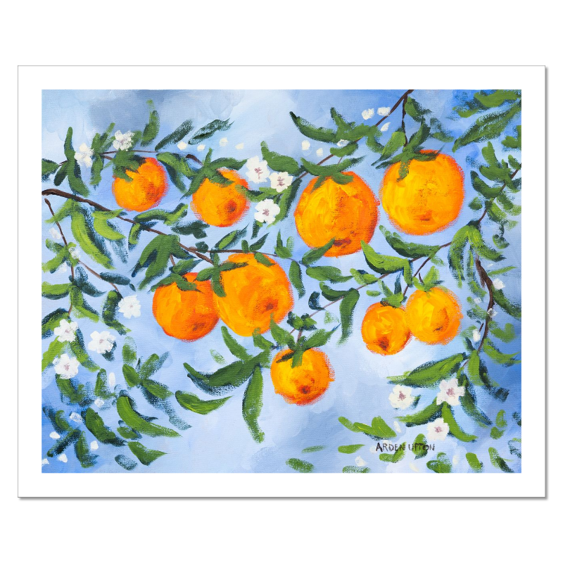 A ready to hang, framed giclee art print featuring a painting of oranges on a tree with white flowers and a blue sky background by Arden Upton from her Orangerie Collection. Art for Gallery walls, kitchens, bright and happy spaces