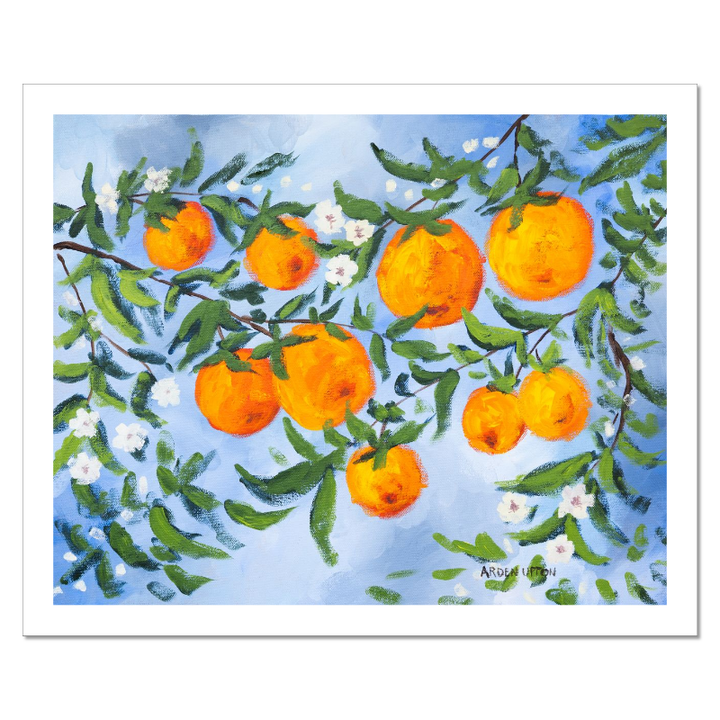 A ready to hang, framed giclee art print featuring a painting of oranges on a tree with white flowers and a blue sky background by Arden Upton from her Orangerie Collection. Art for Gallery walls, kitchens, bright and happy spaces