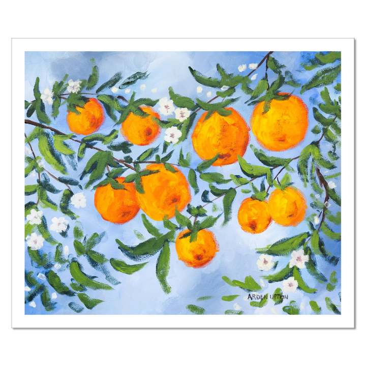 A ready to hang, framed giclee art print featuring a painting of oranges on a tree with white flowers and a blue sky background by Arden Upton from her Orangerie Collection. Art for Gallery walls, kitchens, bright and happy spaces