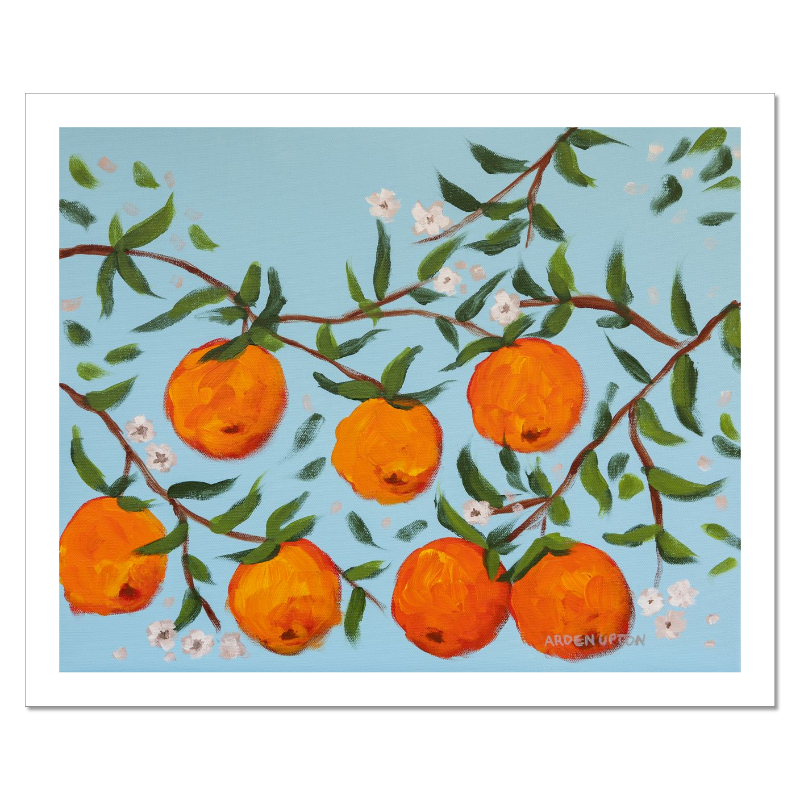A ready to hang, framed giclee art print featuring a painting of oranges on a tree with white flowers and a blue sky background by Arden Upton from her Orangerie Collection. Art for Gallery walls, kitchens, bright and happy spaces
