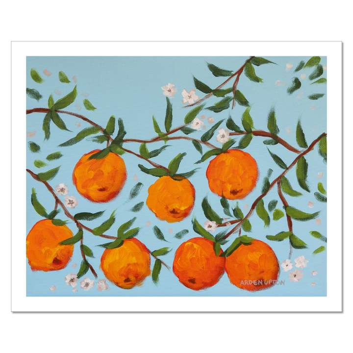 A ready to hang, framed giclee art print featuring a painting of oranges on a tree with white flowers and a blue sky background by Arden Upton from her Orangerie Collection. Art for Gallery walls, kitchens, bright and happy spaces