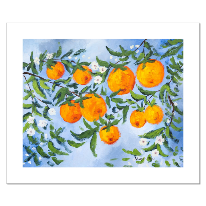 A ready to hang, framed giclee art print featuring a painting of oranges on a tree with white flowers and a blue sky background by Arden Upton from her Orangerie Collection. Art for Gallery walls, kitchens, bright and happy spaces