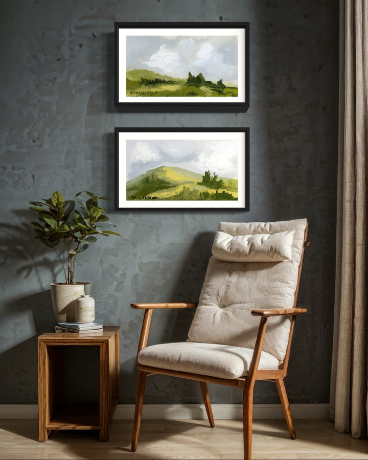 A framed, ready to hang giclee print of green trees and rolling hills with blue sky and white clouds. Paired with another piece from the collection. From an original painting from Arden Upton's Blue Skies Collection. Great for decorating living room, bedroom and hallway walls in your home and gifting