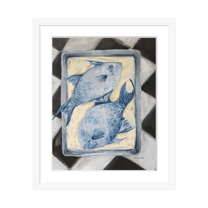 Coastal-inspired Blue Fish painting framed in white – two blue fish on a tray sitting on a black and white checkered surface. A fine art print from the Frank’s Table collection, perfect for dining room or kitchen décor