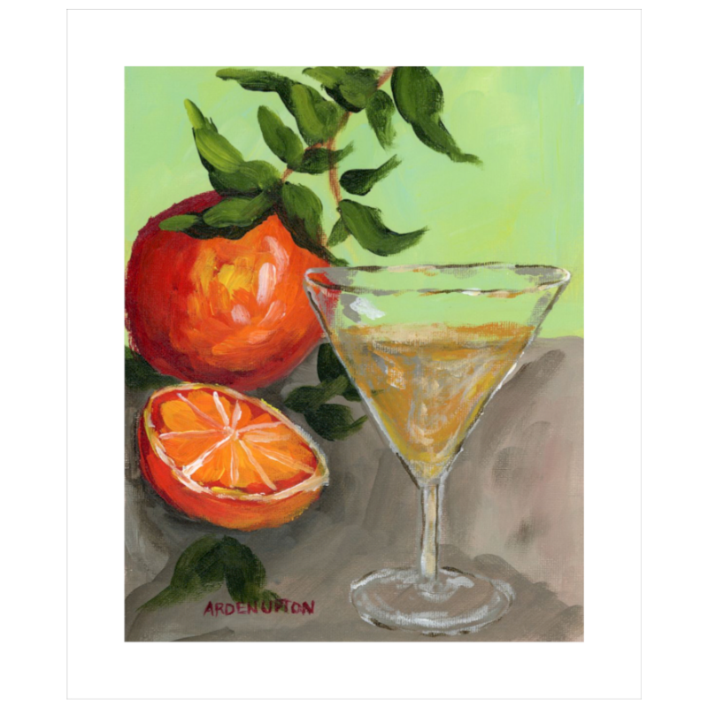 An unframed painting of a yellow Martini and an orange and a half on an orange tree stem sitting. on grey table painted in bold orange, red and green colors, with great texture and detail great for for kitchens, pantries, dining rooms, and entertaining spaces