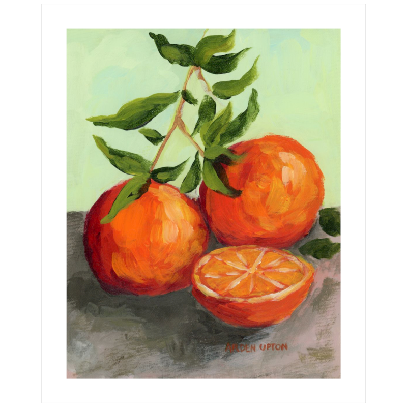 Best gallery wall ideas for dining rooms – citrus art prints in orange, red, and lime green, framed for easy hang and Southern style. This painting shows two and a half oranges with the whole oranges still on the branch.