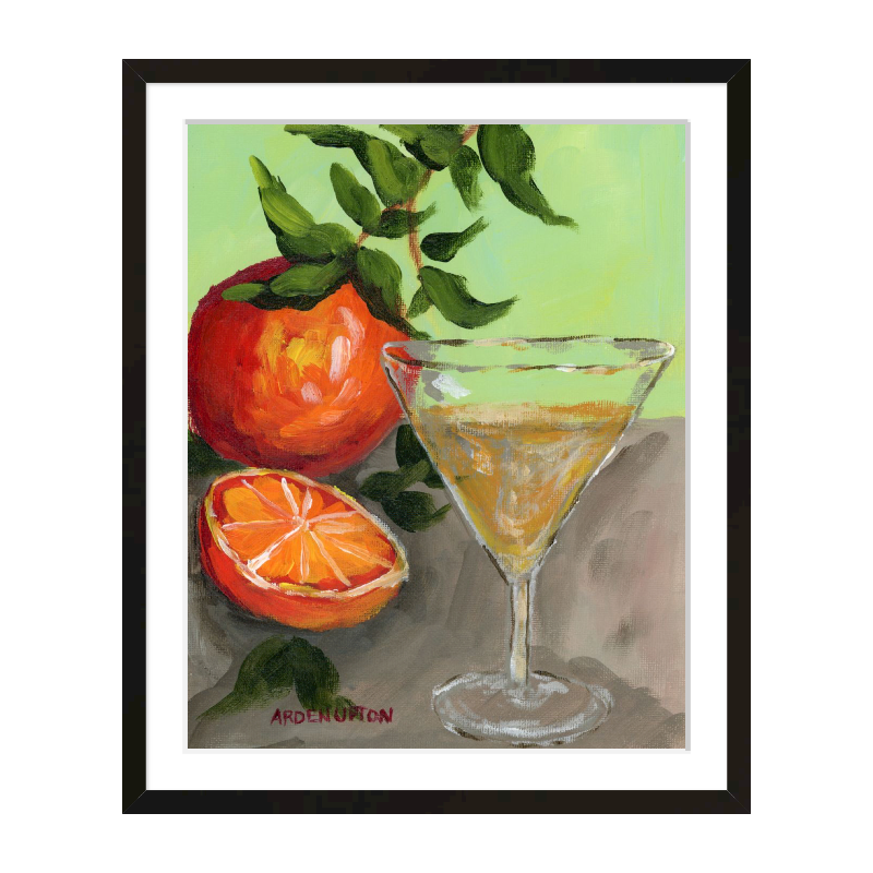 A painting of a yellow Martini and an orange and a half on an orange tree stem sitting. on grey table painted in bold orange, red and green colors, with great texture and detail framed in a black frame. great for for kitchens, pantries, dining rooms, and entertaining spaces