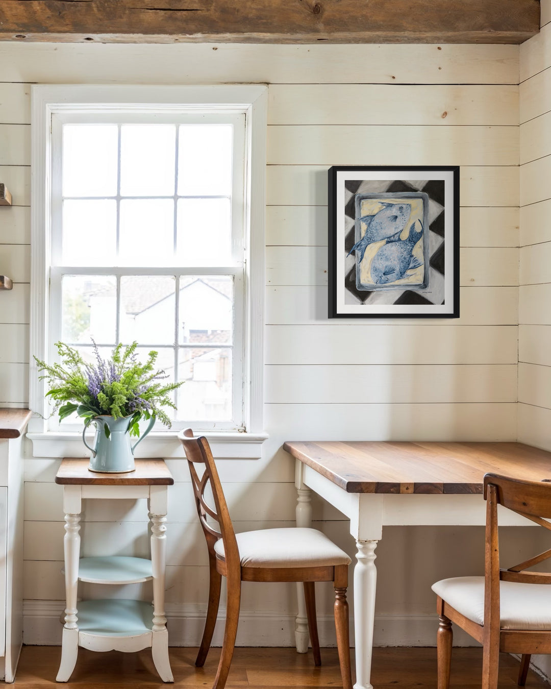 Blue Fish art print of two blue fish on a baking pan sitting on a black and white checkered surface styled in a kitchen nook– A colorful foodie painting from Arden Upton's Frank’s Table collection, perfect for Southern kitchen or pantry walls