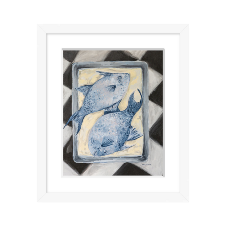 Coastal-inspired Blue Fish painting framed in white – two blue fish on a tray sitting on a black and white checkered surface. A fine art print from the Frank’s Table collection, perfect for dining room or kitchen décor