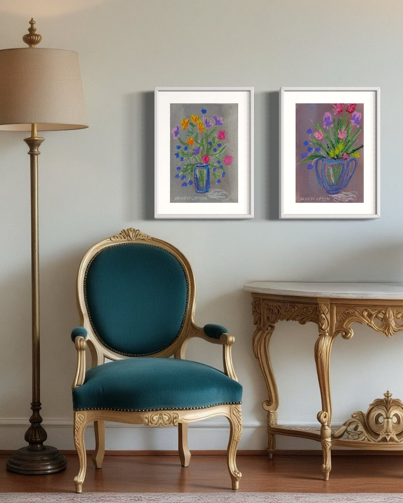 Curated vibrant pair of mixed media floral, botanical giclée prints from Arden Upton's Flowers that last Collection styled in seating space. Beautiful art painting of bright, multi colored flowers in vases
