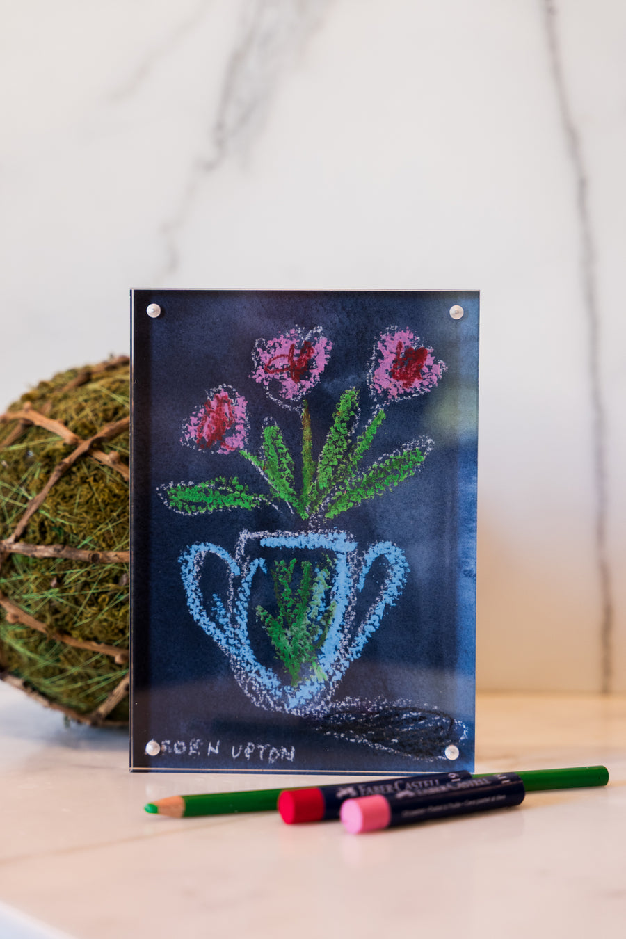 Red and Pink flowers in a blue vase on a navy background with green leaves from Arden Upton's Flowers that Last Collection  Framed in an acrylic block and staged with art supplies and greenery. These make great teachers gifts and hostess gifts and are beautiful. 