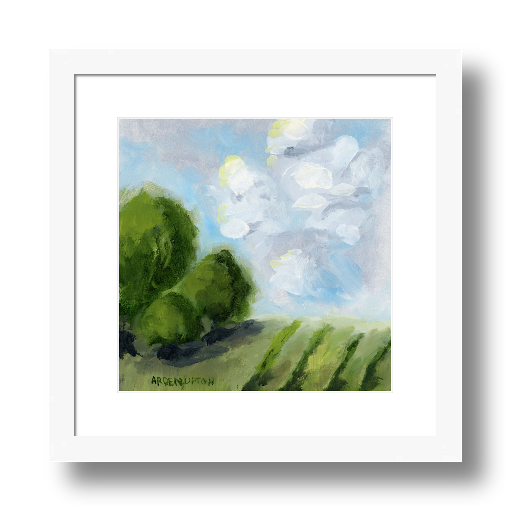 A framed giclée print of a landscape with blue skies, green fields, and trees, titled 'Blue Skies For Days iii'.