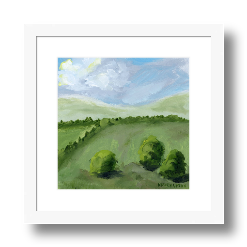 A framed, ready to hang giclee print of green trees and rolling hills with blue sky and white clouds. From an original painting from Arden Upton's Blue Skies Collection. Great for decorating your living room, bedroom and hallway walls in your home