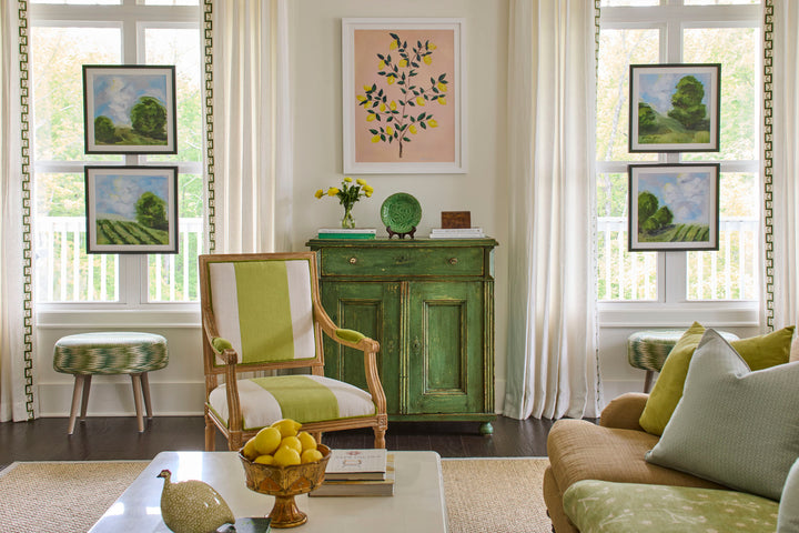 Gallery wall in a living room commission artwork by Arden Upton. Custom fine art paintings and giclée prints with blue skies and green fields—perfect for home decor, gifting, and large or cozy living spaces.