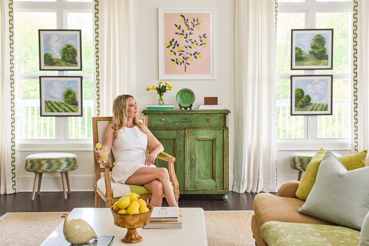 Framed, ready to hang green landscape prints with blue skies from the Blue Skies Collection by Arden Upton, styled as a gallery wall in a bright living room. Original artwork and giclée fine art prints perfect for living rooms, hallways, staircases, or gifting