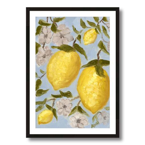 A framed art print featuring a painting from Arden Upton's Lemonade Collection of lemons , leaves and white floral elements against a blue background, with a white mat and black frame.