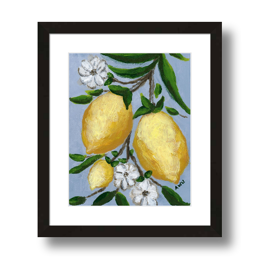 A framed art print featuring a painting from Arden Upton's Lemonade Collection of lemons , leaves and white floral elements against a blue background, with a white mat and black frame.