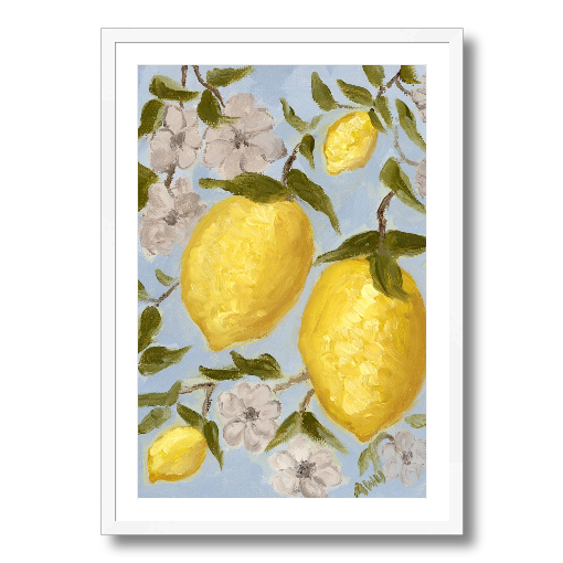 A framed art print featuring a painting from Arden Upton's Lemonade Collection of lemons , leaves and white floral elements against a blue background, with a white mat and black frame.