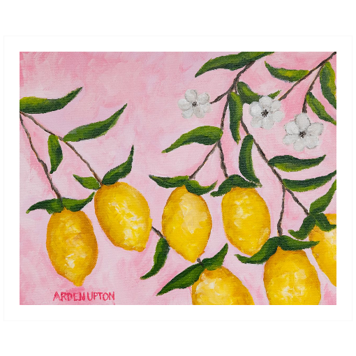 A framed art print featuring a painting from Arden Upton's Lemonade Collection of lemons, leaves and white floral elements against a pink background