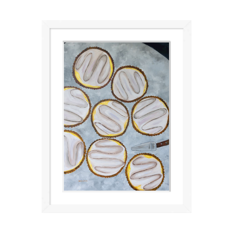 A painting by Southern artist Arden Upton of eight beautifully baked lemon tarts on a table with a tart server. Framed in a white frame
