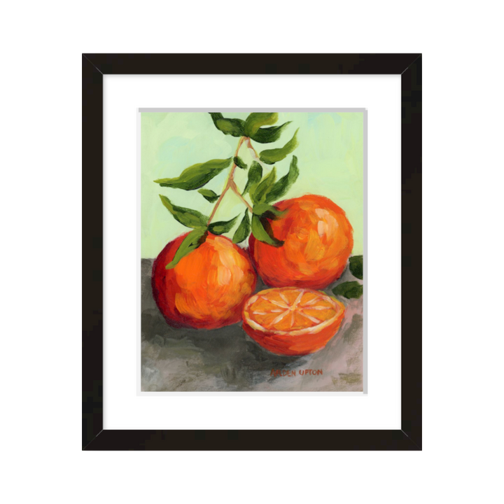 Southern artist Arden Upton gallery wall – lobster and orange paintings with martini art, featuring orange and red on lime green, framed in black or white for kitchens and dining rooms.