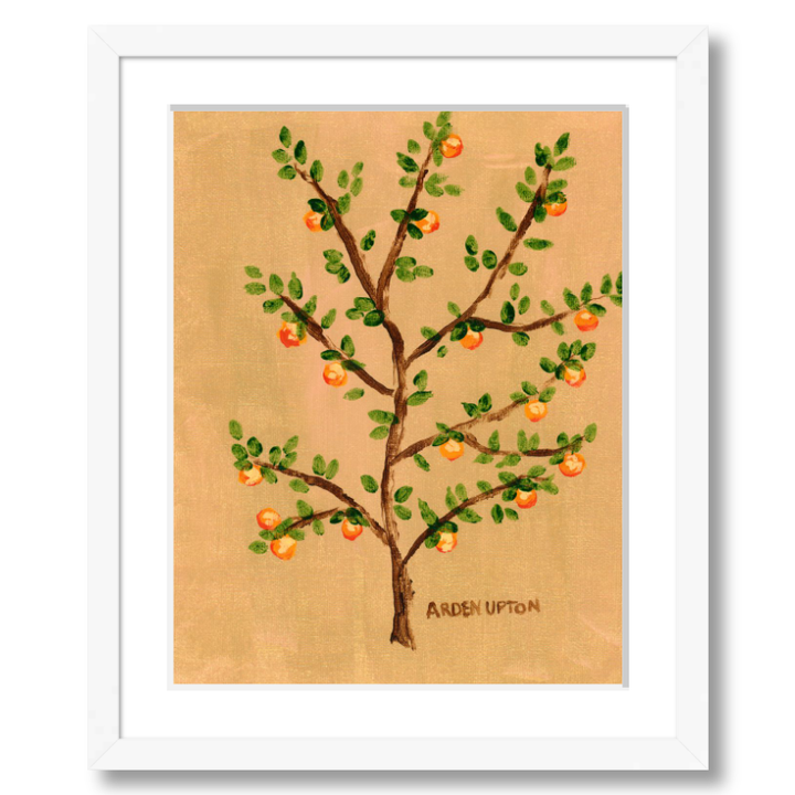 A framed giclee art print of an orange tree with green leaves and orange fruits on a beige and golden background, signed by Arden Ward Upton. Vibrant orange artwork from the Orangerie Collection, ideal for gifting or brightening up any space.