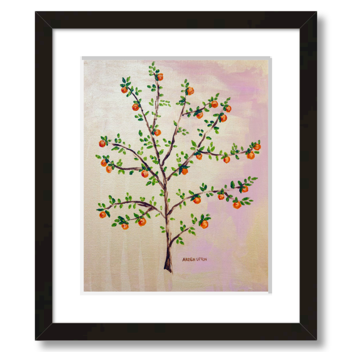 A framed, ready to hang giclee print of an orange tree with green leaves and ripe oranges on a pink and yellow background. An original painting from Arden Upton's Orangerie Collection. Great for decorating walls in kitchens and bright spaces. Buy one or multiple from the collection