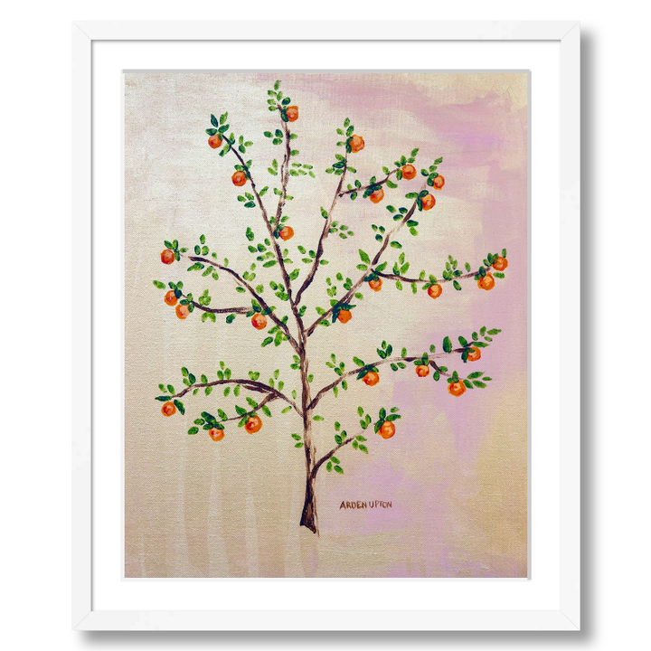 A framed, ready to hang giclee print of an orange tree with green leaves and ripe oranges on a pink and yellow background. An original painting from Arden Upton's Orangerie Collection. Great for decorating walls in kitchens and bright spaces. Buy one or multiple from the collection