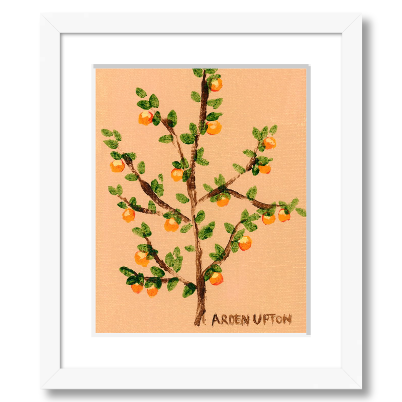 A framed artwork of an orange tree with green leaves and orange fruits on a peach-colored background, signed by Arden Upton.