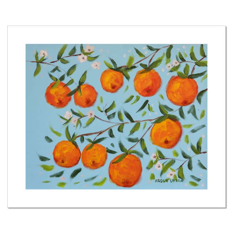 A ready to hang, framed giclee art print featuring a painting of oranges on a tree with white flowers and a blue sky background by Arden Upton from her Orangerie Collection. Art for Gallery walls, kitchens, bright and happy spaces