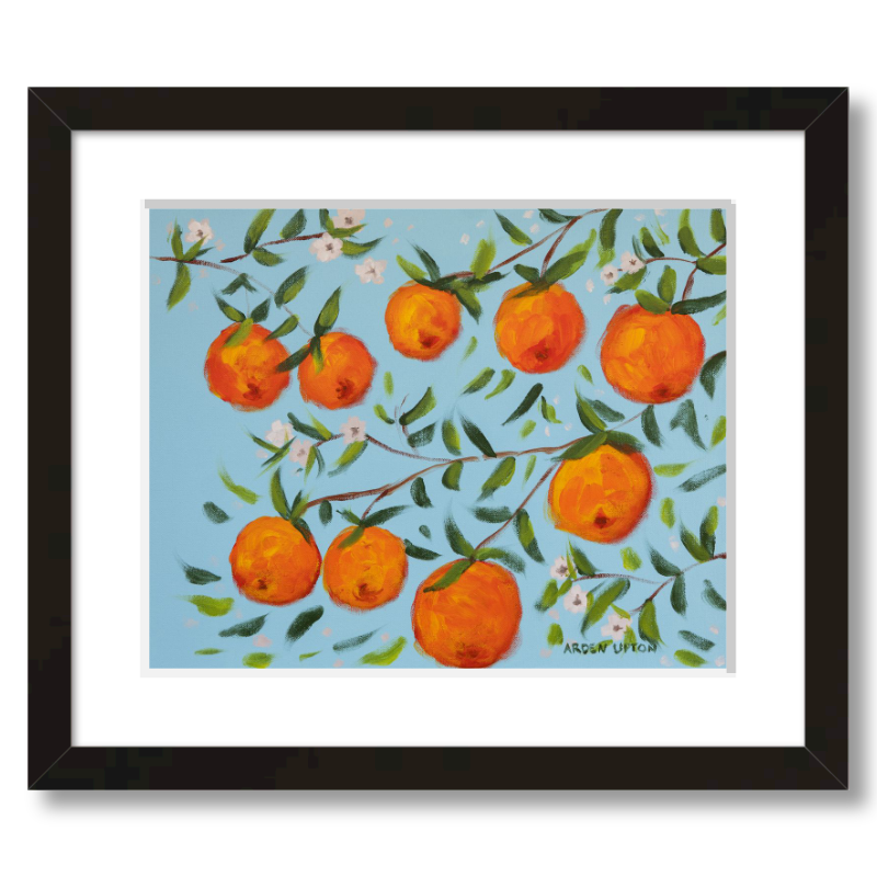 A ready to hang, framed giclee art print featuring a painting of oranges on a tree with white flowers and a blue sky background by Arden Upton from her Orangerie Collection. Art for Gallery walls, kitchens, bright and happy spaces
