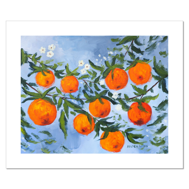 A ready to hang, framed giclee art print featuring a painting of oranges on a tree with white flowers and a blue sky background by Arden Upton from her Orangerie Collection. Art for Gallery walls, kitchens, bright and happy spaces