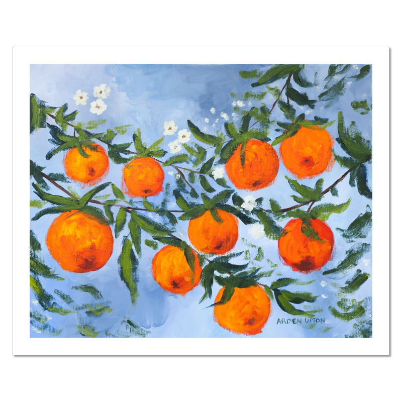 A ready to hang, framed giclee art print featuring a painting of oranges on a tree with white flowers and a blue sky background by Arden Upton from her Orangerie Collection. Art for Gallery walls, kitchens, bright and happy spaces