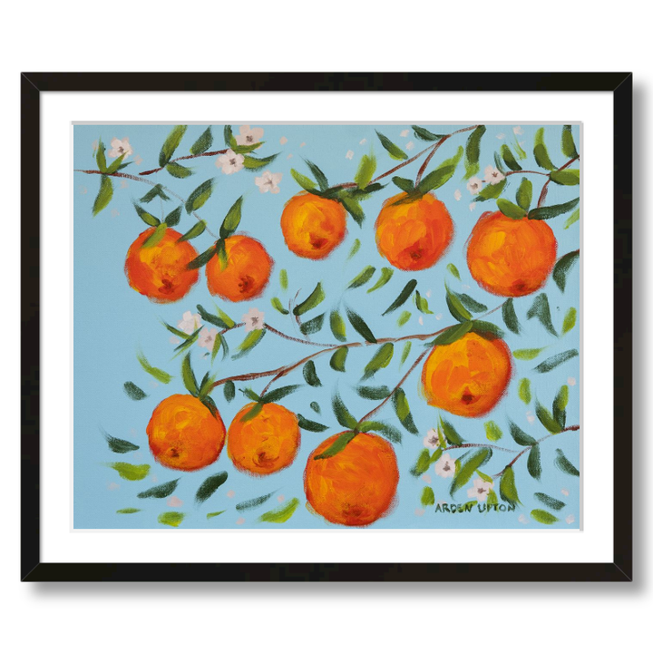 A ready to hang, framed giclee art print featuring a painting of oranges on a tree with white flowers and a blue sky background by Arden Upton from her Orangerie Collection. Art for Gallery walls, kitchens, bright and happy spaces