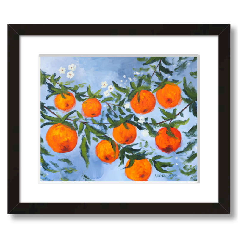 A ready to hang, framed giclee art print featuring a painting of oranges on a tree with white flowers and a blue sky background by Arden Upton from her Orangerie Collection. Art for Gallery walls, kitchens, bright and happy spaces