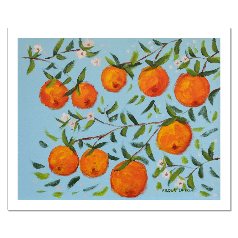 A ready to hang, framed giclee art print featuring a painting of oranges on a tree with white flowers and a blue sky background by Arden Upton from her Orangerie Collection. Art for Gallery walls, kitchens, bright and happy spaces