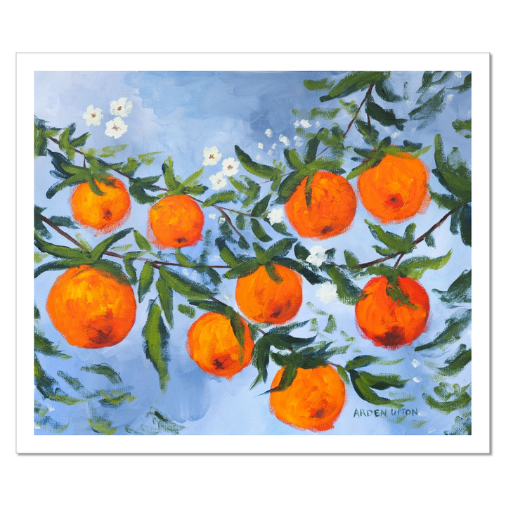 A ready to hang, framed giclee art print featuring a painting of oranges on a tree with white flowers and a blue sky background by Arden Upton from her Orangerie Collection. Art for Gallery walls, kitchens, bright and happy spaces