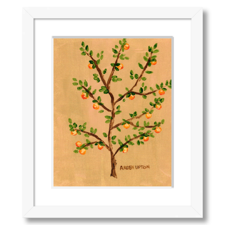 A framed giclee art print of an orange tree with green leaves and orange fruits on a beige and golden background. A vibrant painting by Arden Upton from her Orangerie Collection, ideal for gifting or brightening up any space.