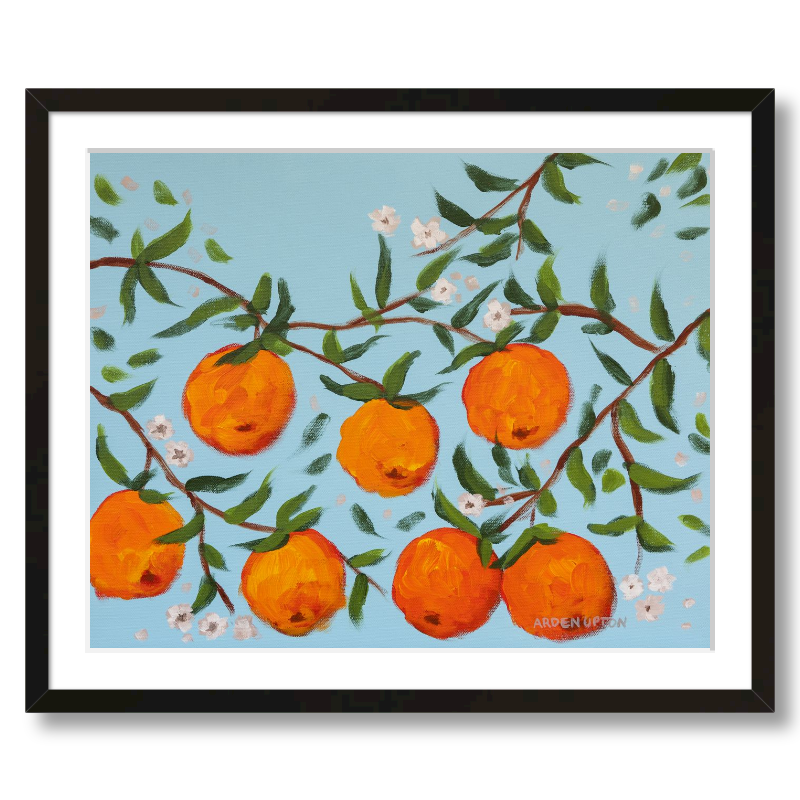 A ready to hang, framed giclee art print featuring a painting of oranges on a tree with white flowers and a blue sky background by Arden Upton from her Orangerie Collection. Art for Gallery walls, kitchens, bright and happy spaces
