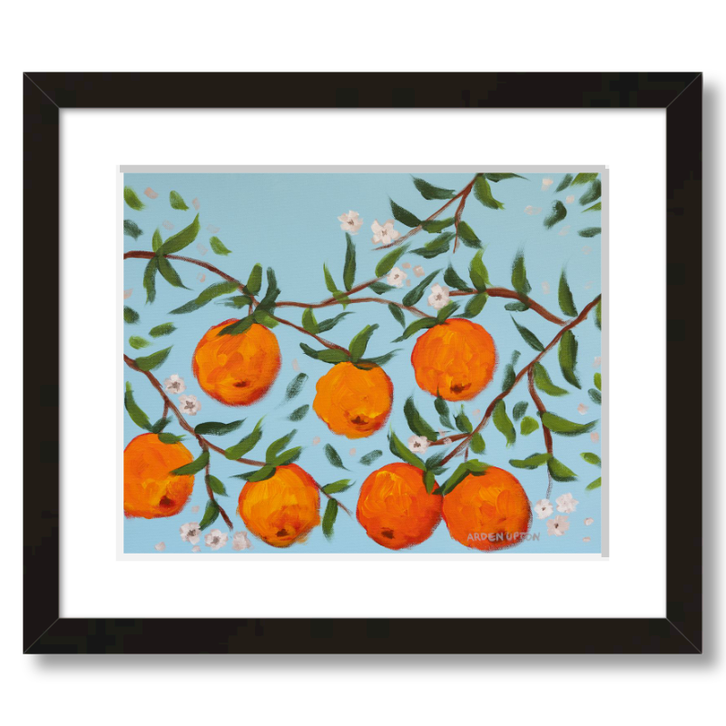 A ready to hang, framed giclee art print featuring a painting of oranges on a tree with white flowers and a blue sky background by Arden Upton from her Orangerie Collection. Art for Gallery walls, kitchens, bright and happy spaces