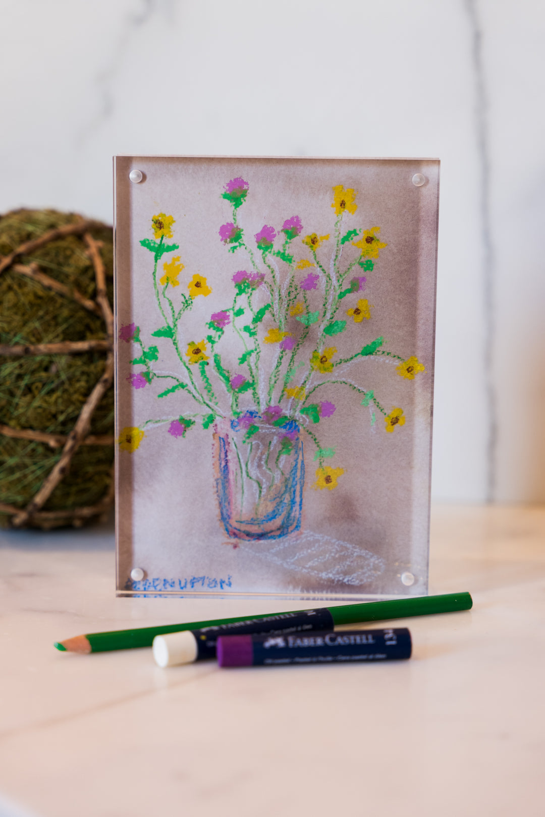 yellow and Pink flowers in a blue vase on a pink background with green leaves from Arden Upton's Flowers that Last Collection  Framed in an acrylic block and staged with art supplies and greenery. These make great teachers gifts and hostess gifts and are beautiful. 