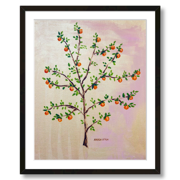 A framed, ready to hang giclee print of an orange tree with green leaves and ripe oranges on a pink and yellow background. An original painting from Arden Upton's Orangerie Collection. Great for decorating walls in kitchens and bright spaces. Buy one or multiple from the collection