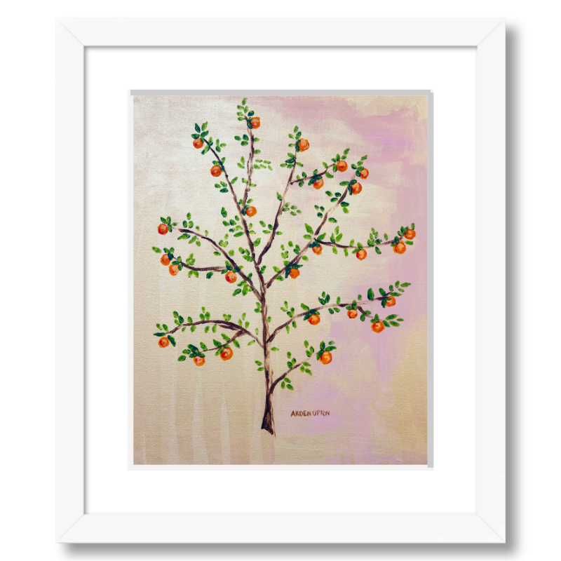 A framed, ready to hang giclee print of an orange tree with green leaves and ripe oranges on a pink and yellow background. An original painting from Arden Upton's Orangerie Collection. Great for decorating walls in kitchens and bright spaces. Buy one or multiple from the collection