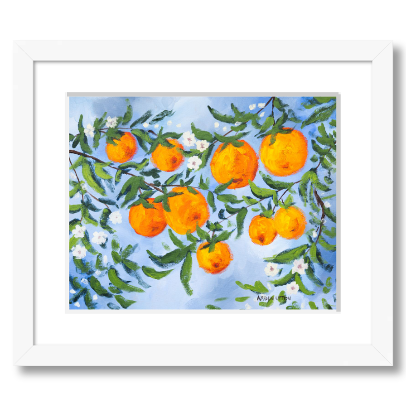 A ready to hang, framed giclee art print featuring a painting of oranges on a tree with white flowers and a blue sky background by Arden Upton from her Orangerie Collection. Art for Gallery walls, kitchens, bright and happy spaces